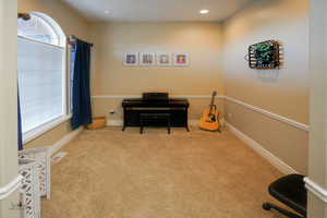 Miscellaneous room featuring light colored carpet and recessed lighting