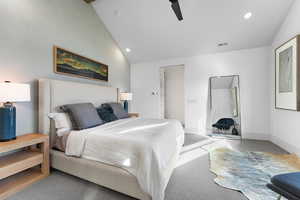 Carpeted bedroom featuring recessed lighting, ceiling fan, and high vaulted ceiling