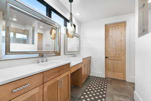 Bathroom featuring double vanity and recessed lighting