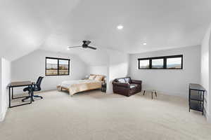 Bedroom featuring light carpet, a ceiling fan, lofted ceiling, and recessed lighting