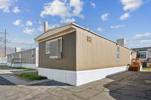 View of property exterior with a mountain view