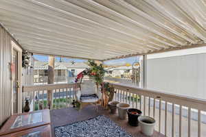 Sunroom / solarium featuring a residential view