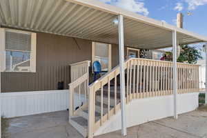 Entrance to property featuring a patio area