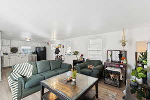 Living area with light wood-style floors