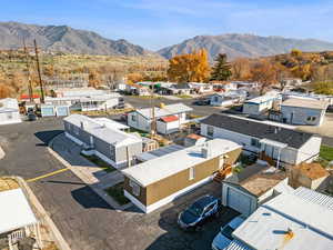 Aerial perspective of suburban area with a mountain backdrop