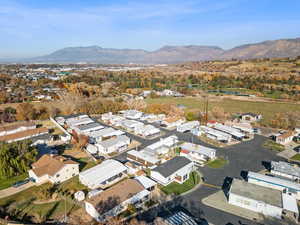 Aerial view of residential area featuring a water and mountain view