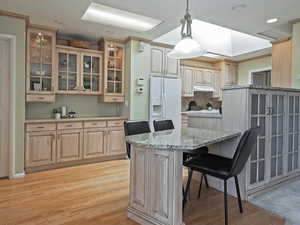 Kitchen with glass insert cabinets,