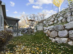 Private back yard with pergola and gazebo,  grassy yard with a patio area, vegetable garden, access to golf course.