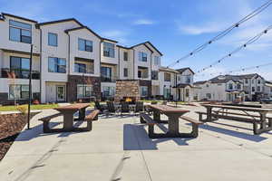 View of community featuring a residential view and a patio area
