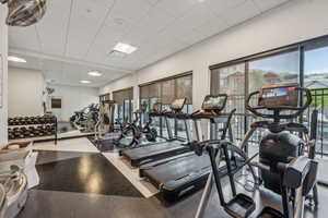 Workout area featuring a paneled ceiling