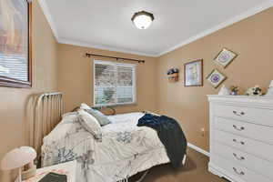 Bedroom featuring crown molding