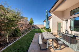 Fenced backyard featuring a patio area