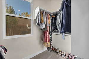Walk in closet featuring carpet