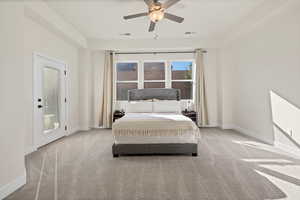 Bedroom with light carpet, access to outside, and ceiling fan