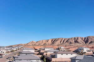 View of mountain background featuring nearby suburban area