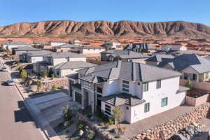 Aerial view of residential area with a mountain backdrop