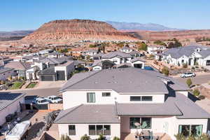 Aerial view of residential area featuring a mountainous background