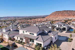 Aerial perspective of suburban area featuring a mountain backdrop