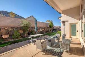 Fenced backyard featuring a patio