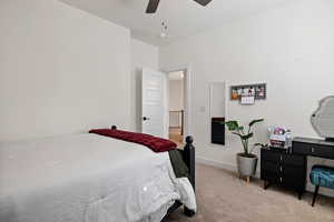 Bedroom featuring carpet flooring and ceiling fan