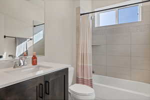 Full bathroom with vanity and shower / tub combo with curtain
