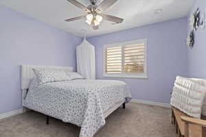 Bedroom with carpet and a ceiling fan