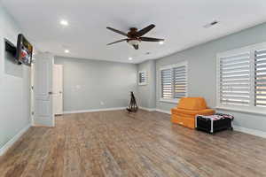 Miscellaneous room with a ceiling fan, hardwood / wood-style flooring, and recessed lighting
