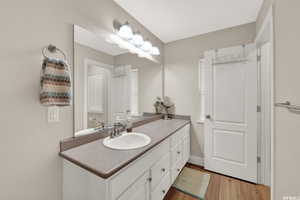 Bathroom featuring vanity and light wood finished floors
