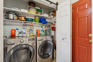 Laundry area with washing machine and clothes dryer
