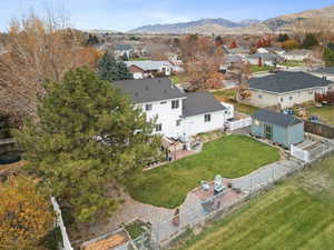 Aerial perspective of suburban area with a mountainous background
