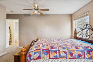 Bedroom featuring carpet and ceiling fan