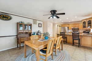 Dining room with light tile patterned floors, recessed lighting, and ceiling fan