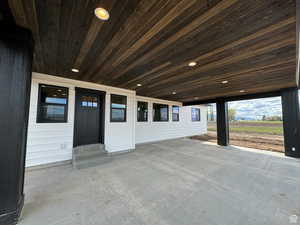 Entrance to property featuring a patio