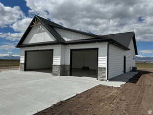 Garage featuring a mountain view and concrete driveway