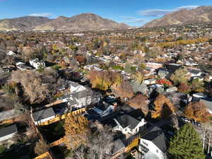 View of property location featuring mountains and nearby suburban area