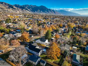 Aerial perspective of suburban area with a mountain backdrop