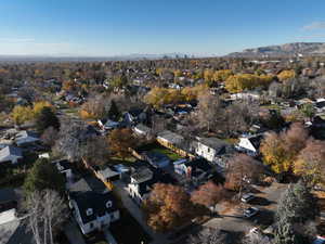 View of property location featuring mountains and nearby suburban area
