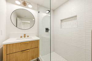 Bathroom with vanity and a walk in shower