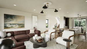 Renderings are for illustrative purposes only.Features, finishes, dimensions, layouts, landscaping, and amenities shown are conceptual and subject to change without notice. Actual construction may vary. Living room with recessed lighting, wood finished f