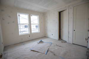Unfurnished bedroom with baseboards