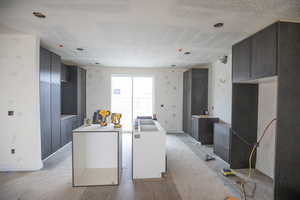Kitchen featuring a kitchen island and wood finished floors
