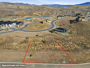 Aerial view of property's location featuring a mountain backdrop and property boundaries highlighted