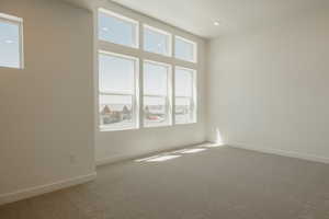 Spare room with carpet floors and baseboards