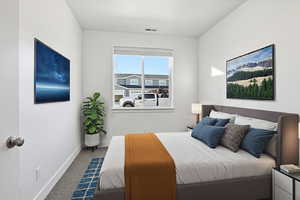 Bedroom with carpet and baseboards