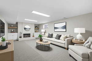 Carpeted living area featuring a brick fireplace and built in shelves