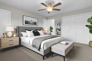 Bedroom with dark carpet, a ceiling fan, and a closet