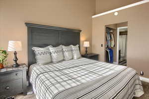 Bedroom with carpet floors and connected bathroom