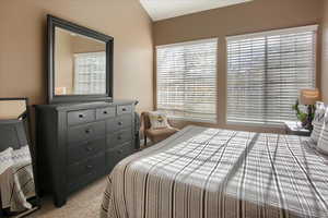 Bedroom featuring light colored carpet