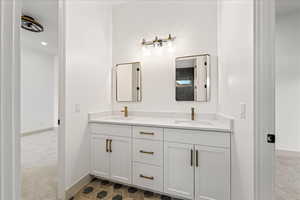 Full bathroom with light colored carpet, double vanity, and recessed lighting