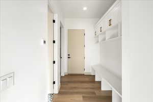 Mudroom area featuring light wood-style floors and recessed lighting